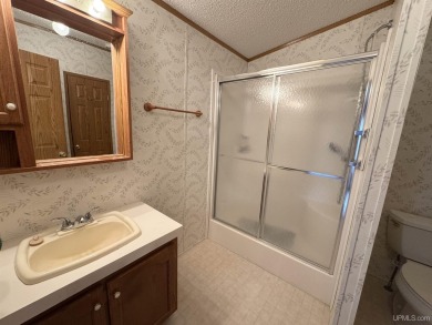 Welcome to this well-maintained 3-bedroom, 2-bath manufactured on Crystal View Municipal Golf Course in Michigan - for sale on GolfHomes.com, golf home, golf lot