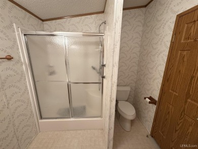 Welcome to this well-maintained 3-bedroom, 2-bath manufactured on Crystal View Municipal Golf Course in Michigan - for sale on GolfHomes.com, golf home, golf lot