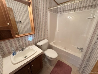Welcome to this well-maintained 3-bedroom, 2-bath manufactured on Crystal View Municipal Golf Course in Michigan - for sale on GolfHomes.com, golf home, golf lot