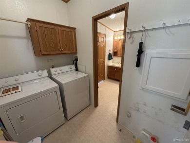 Welcome to this well-maintained 3-bedroom, 2-bath manufactured on Crystal View Municipal Golf Course in Michigan - for sale on GolfHomes.com, golf home, golf lot