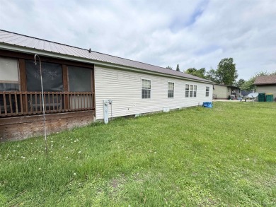 Welcome to this well-maintained 3-bedroom, 2-bath manufactured on Crystal View Municipal Golf Course in Michigan - for sale on GolfHomes.com, golf home, golf lot