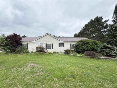 Welcome to this well-maintained 3-bedroom, 2-bath manufactured on Crystal View Municipal Golf Course in Michigan - for sale on GolfHomes.com, golf home, golf lot