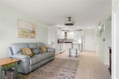 Discover your second floor haven overlooking lush greens of a on Ocean Village Golf Course in Florida - for sale on GolfHomes.com, golf home, golf lot