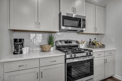 Discover the charm of low-maintenance living in this beautifully on Cape Fear National At Brunswick Forest in North Carolina - for sale on GolfHomes.com, golf home, golf lot