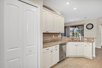 Welcome to a life that feels like vacation every day. Nestled in on Arlington Ridge Golf Club in Florida - for sale on GolfHomes.com, golf home, golf lot