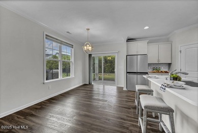 Discover the charm of low-maintenance living in this beautifully on Cape Fear National At Brunswick Forest in North Carolina - for sale on GolfHomes.com, golf home, golf lot