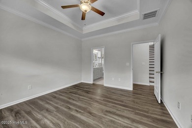 Discover the charm of low-maintenance living in this beautifully on Cape Fear National At Brunswick Forest in North Carolina - for sale on GolfHomes.com, golf home, golf lot