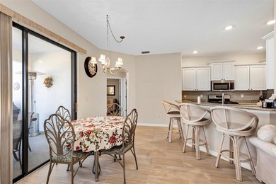 Welcome to a life that feels like vacation every day. Nestled in on Arlington Ridge Golf Club in Florida - for sale on GolfHomes.com, golf home, golf lot