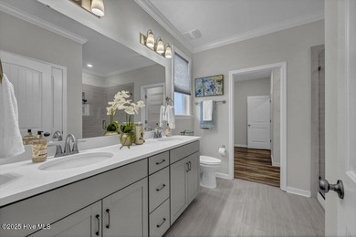 Discover the charm of low-maintenance living in this beautifully on Cape Fear National At Brunswick Forest in North Carolina - for sale on GolfHomes.com, golf home, golf lot