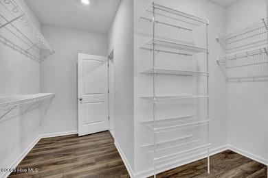 Discover the charm of low-maintenance living in this beautifully on Cape Fear National At Brunswick Forest in North Carolina - for sale on GolfHomes.com, golf home, golf lot