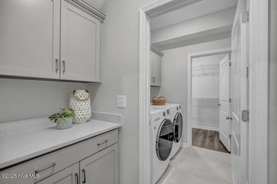 Discover the charm of low-maintenance living in this beautifully on Cape Fear National At Brunswick Forest in North Carolina - for sale on GolfHomes.com, golf home, golf lot