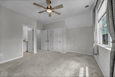 Discover the charm of low-maintenance living in this beautifully on Cape Fear National At Brunswick Forest in North Carolina - for sale on GolfHomes.com, golf home, golf lot