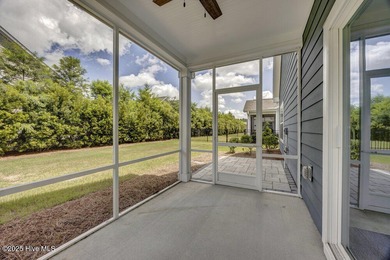 Discover the charm of low-maintenance living in this beautifully on Cape Fear National At Brunswick Forest in North Carolina - for sale on GolfHomes.com, golf home, golf lot