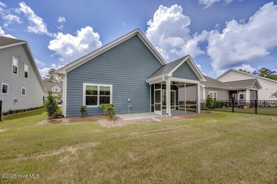 Discover the charm of low-maintenance living in this beautifully on Cape Fear National At Brunswick Forest in North Carolina - for sale on GolfHomes.com, golf home, golf lot