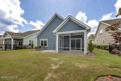 Discover the charm of low-maintenance living in this beautifully on Cape Fear National At Brunswick Forest in North Carolina - for sale on GolfHomes.com, golf home, golf lot