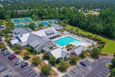 Discover the charm of low-maintenance living in this beautifully on Cape Fear National At Brunswick Forest in North Carolina - for sale on GolfHomes.com, golf home, golf lot