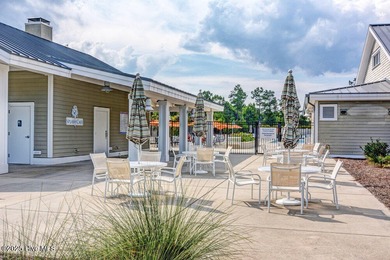 Discover the charm of low-maintenance living in this beautifully on Cape Fear National At Brunswick Forest in North Carolina - for sale on GolfHomes.com, golf home, golf lot