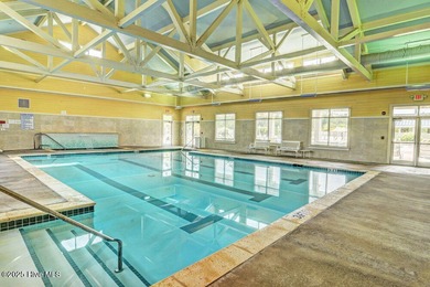 Discover the charm of low-maintenance living in this beautifully on Cape Fear National At Brunswick Forest in North Carolina - for sale on GolfHomes.com, golf home, golf lot