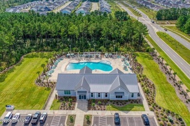 Discover the charm of low-maintenance living in this beautifully on Cape Fear National At Brunswick Forest in North Carolina - for sale on GolfHomes.com, golf home, golf lot