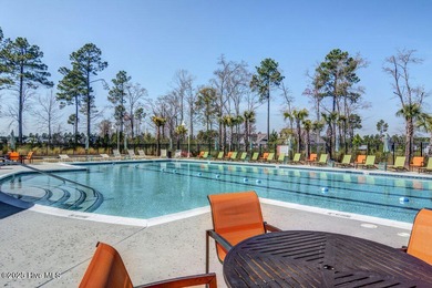 Discover the charm of low-maintenance living in this beautifully on Cape Fear National At Brunswick Forest in North Carolina - for sale on GolfHomes.com, golf home, golf lot