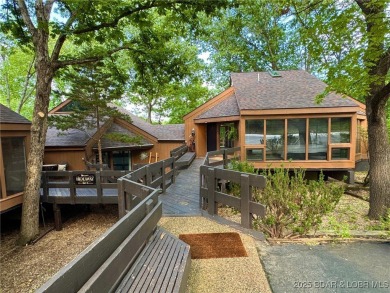 Tucked among mature trees, this unique beautifully updated on Seasons Ridge At Four Seasons in Missouri - for sale on GolfHomes.com, golf home, golf lot