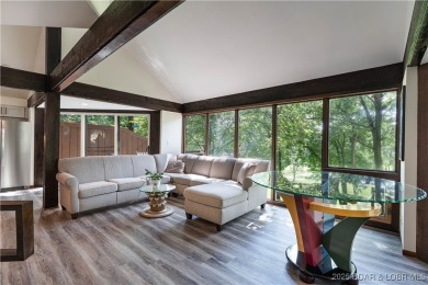 Tucked among mature trees, this unique beautifully updated on Seasons Ridge At Four Seasons in Missouri - for sale on GolfHomes.com, golf home, golf lot