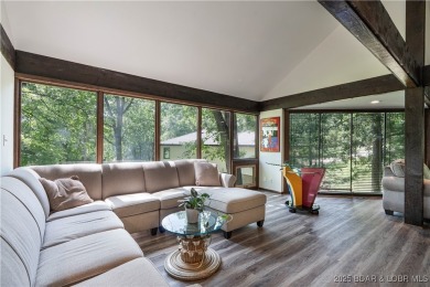 Tucked among mature trees, this unique beautifully updated on Seasons Ridge At Four Seasons in Missouri - for sale on GolfHomes.com, golf home, golf lot
