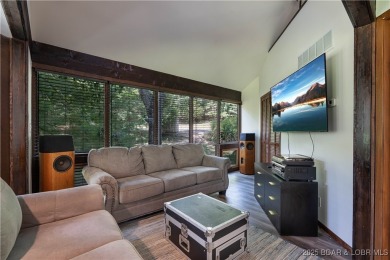 Tucked among mature trees, this unique beautifully updated on Seasons Ridge At Four Seasons in Missouri - for sale on GolfHomes.com, golf home, golf lot