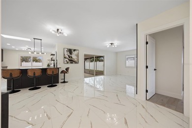 Welcome to the highly desirable Shore Acres neighborhood, where on Mangrove Bay Golf Course in Florida - for sale on GolfHomes.com, golf home, golf lot