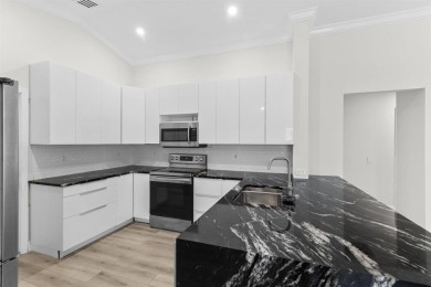 Welcome to this beautifully updated 3BR/2BA one-story home in on Weston Hills Country Club in Florida - for sale on GolfHomes.com, golf home, golf lot