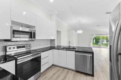 Welcome to this beautifully updated 3BR/2BA one-story home in on Weston Hills Country Club in Florida - for sale on GolfHomes.com, golf home, golf lot