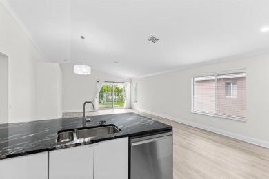 Welcome to this beautifully updated 3BR/2BA one-story home in on Weston Hills Country Club in Florida - for sale on GolfHomes.com, golf home, golf lot