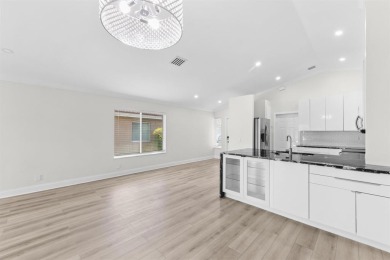 Welcome to this beautifully updated 3BR/2BA one-story home in on Weston Hills Country Club in Florida - for sale on GolfHomes.com, golf home, golf lot