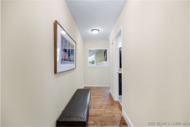 This charming 2,397 sq ft lakefront home in Tan-Tar-A Estates on The Oaks Golf Course in Missouri - for sale on GolfHomes.com, golf home, golf lot