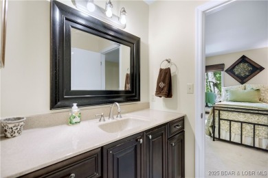 This charming 2,397 sq ft lakefront home in Tan-Tar-A Estates on The Oaks Golf Course in Missouri - for sale on GolfHomes.com, golf home, golf lot