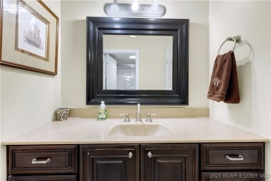 This charming 2,397 sq ft lakefront home in Tan-Tar-A Estates on The Oaks Golf Course in Missouri - for sale on GolfHomes.com, golf home, golf lot