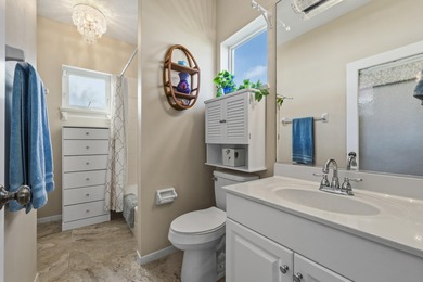 This meticulously maintained residence offers extensive updates on Santa Lucia River Club in Florida - for sale on GolfHomes.com, golf home, golf lot