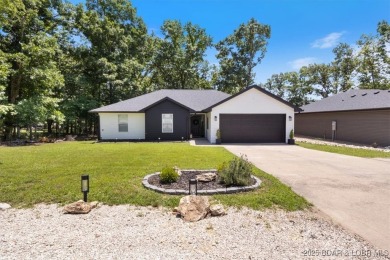 Enjoy a crisp morning sipping your morning coffee and watching on Tan-Tar-A Golf Club in Missouri - for sale on GolfHomes.com, golf home, golf lot