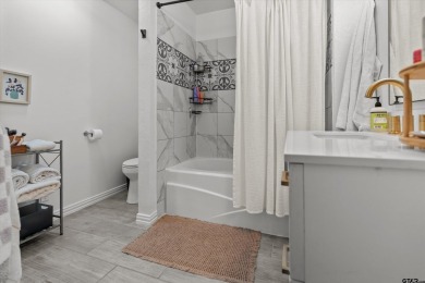 Located in the desirable Hideaway Lake Community, this charming on Hide-A-Way Lake Golf Course in Texas - for sale on GolfHomes.com, golf home, golf lot
