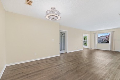 Located in the gated and guard-attended Kings Point community on Falcon Watch Golf Club in Florida - for sale on GolfHomes.com, golf home, golf lot