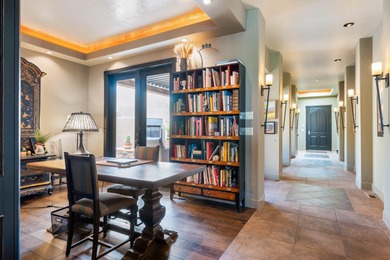 This elegant home sits on the Entrada Fairway with large windows on Entrada at Snow Canyon in Utah - for sale on GolfHomes.com, golf home, golf lot