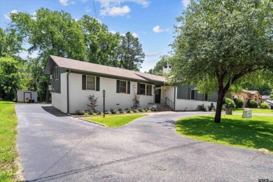 Located in the desirable Hideaway Lake Community, this charming on Hide-A-Way Lake Golf Course in Texas - for sale on GolfHomes.com, golf home, golf lot