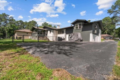 Located in the desirable Hideaway Lake Community, this charming on Hide-A-Way Lake Golf Course in Texas - for sale on GolfHomes.com, golf home, golf lot