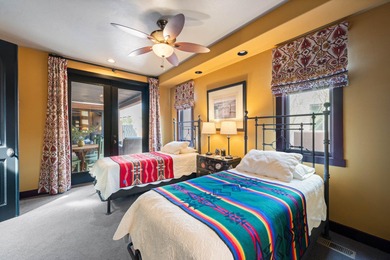 This elegant home sits on the Entrada Fairway with large windows on Entrada at Snow Canyon in Utah - for sale on GolfHomes.com, golf home, golf lot