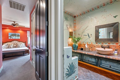 This elegant home sits on the Entrada Fairway with large windows on Entrada at Snow Canyon in Utah - for sale on GolfHomes.com, golf home, golf lot