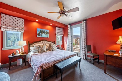 This elegant home sits on the Entrada Fairway with large windows on Entrada at Snow Canyon in Utah - for sale on GolfHomes.com, golf home, golf lot