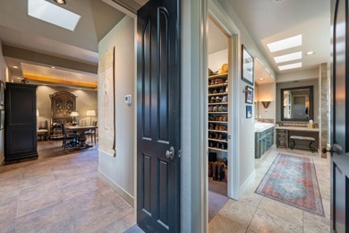 This elegant home sits on the Entrada Fairway with large windows on Entrada at Snow Canyon in Utah - for sale on GolfHomes.com, golf home, golf lot