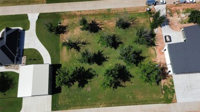 Fly in and see this ready-to-build lot in the highly on Pecan Plantation Country Club in Texas - for sale on GolfHomes.com, golf home, golf lot