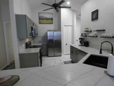 Welcome to this beautifully maintained 3-bedroom, 2-bathroom, 2 on Silverado Golf and Country Club in Florida - for sale on GolfHomes.com, golf home, golf lot