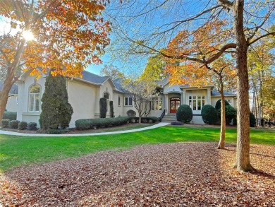 This Florida-style, hard stucco home is a beautiful ranch home on Trump National Golf Club Charlotte in North Carolina - for sale on GolfHomes.com, golf home, golf lot